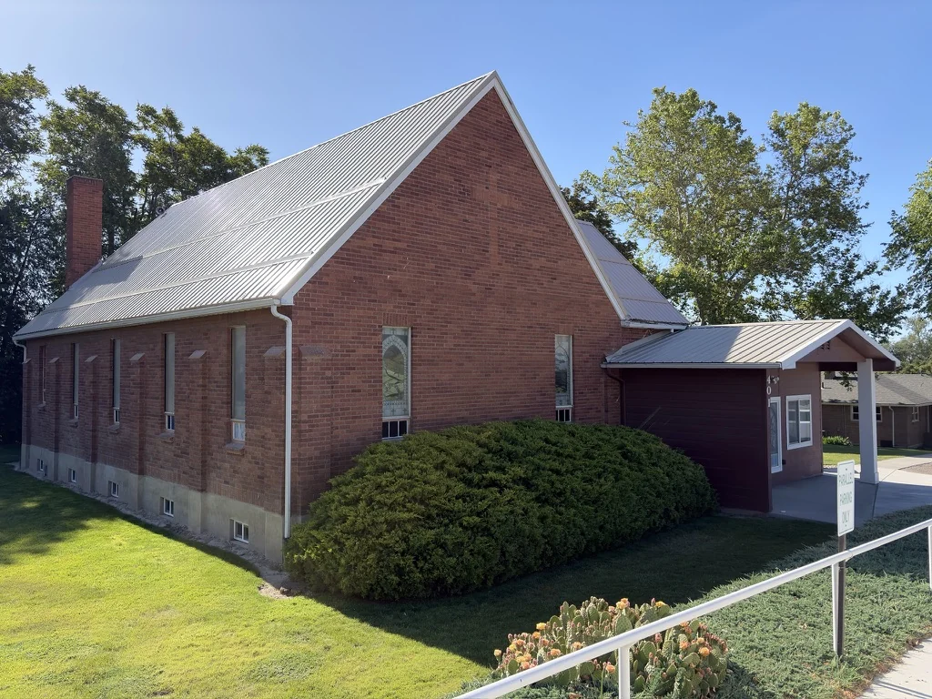 Adrian Community Church exterior with the covered entrance on the right